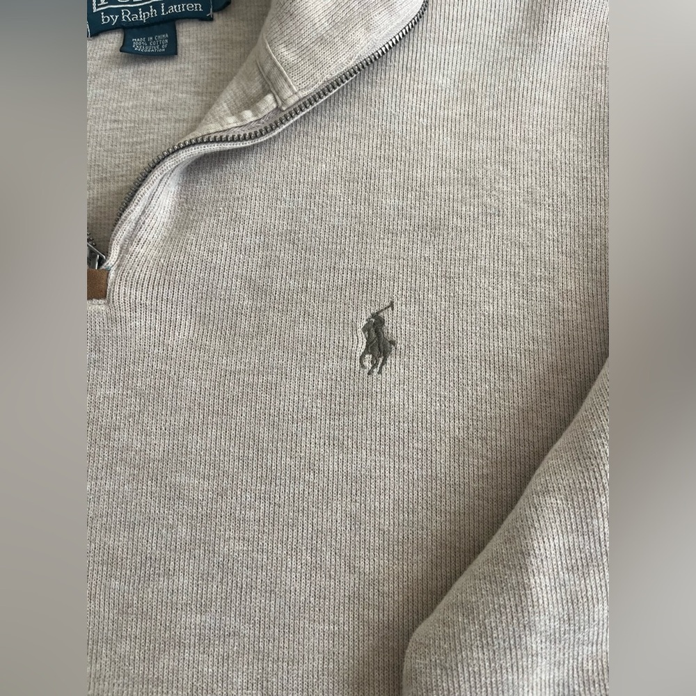 Pullover zip up neck.